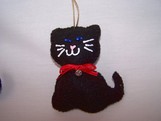 black kitten with blue eyes ornament