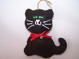 black kitten with green eyes ornament